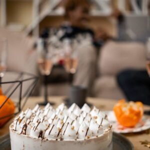 A delectable meringue cake on a cozy table setting, perfect for special occasions.